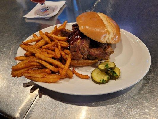 Country style smoked pork sandwich with beer fries. No coleslaw because they ran out for the night.