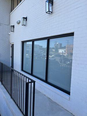 White frost applied to this commercial building's 3 lite window