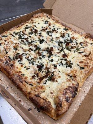 Sicilian pizza with Alfredo sauce, chicken and spinach.