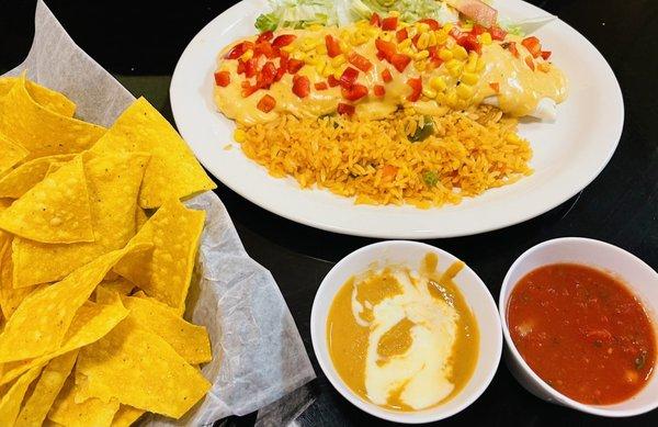 Burrito chipotle with bean dip, salsa, and fresh tortilla chips!