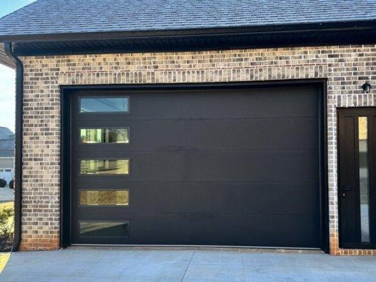 Black Steel backing insulated door/w glass panes.