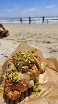 Pistachio Croissant on the beach