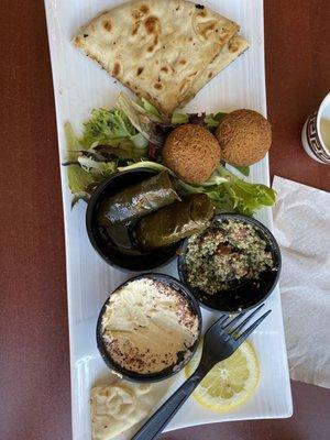 Combo platter with humus, falafel, grape leaves, pita bread and tabouli