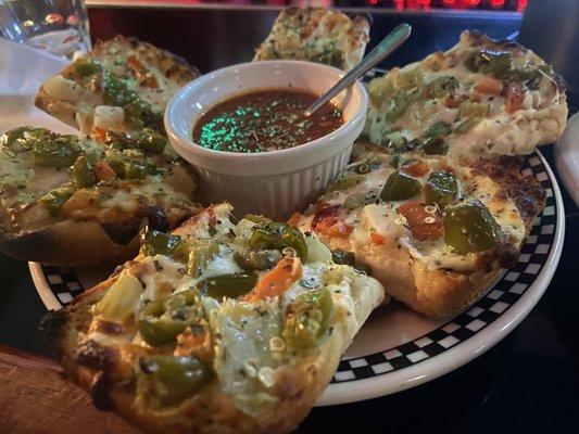 Garlic cheese bread with toppings.