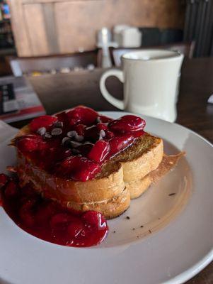 Mascarpone slathered between two slices of French toast with strawberry compote