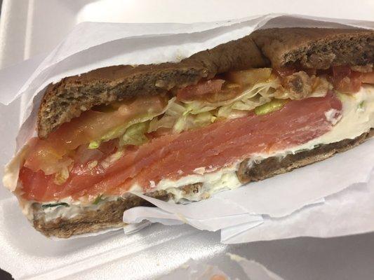 Sliced lox, scallion cream cheese, and the works on a raisin bagel. Seems like they forgot the works, but it was good despite this.