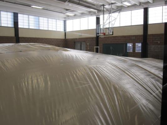 gymnasium floor flooded when kids hit the sprinkler above with a ball!!