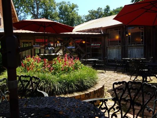 Outdoor seating area with fountain at Mr Joe's.