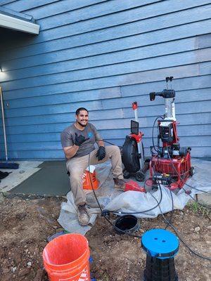 Epoxy brush coating the sewer line and installed sewer clean outs