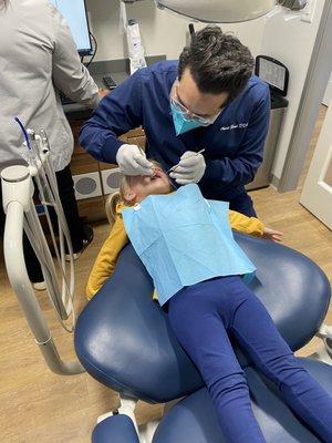 The doctor is checking each tooth!  All is great!