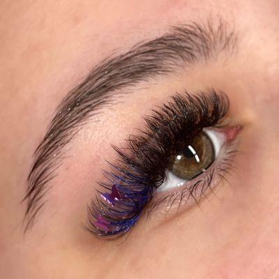 Volume lashes with blue lashes and purple butterfly decals