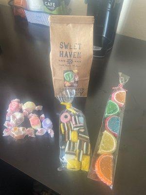 Our treats from this trip! Salt water taffy bag plus some samples to try, licorice based bagged candy & gummy / jelly bagged candy.