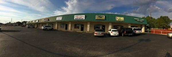 Panoramic view showing relative location in the shopping strip on the corner of Palm Valley Blvd and Sunrise.