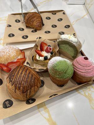 Marizatto, Pain au Chocolat, Bread Pudding, Matcha Cruffin, Raspberry Cruffin, Matcha Tokyo Roll, and regular Crossiant