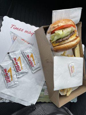 In-N-Out Cheeseburger with fries, including condiments.