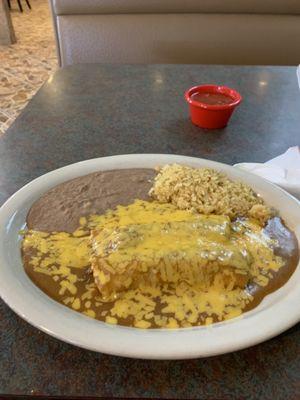 My yummy beef enchilada, dinner with rice and beans and gobs of cheddar cheese!!