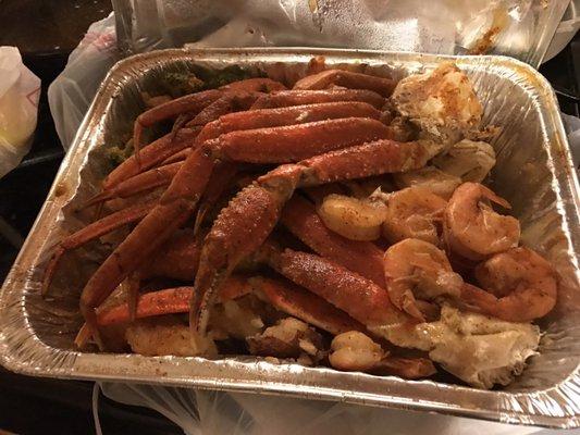 #29 small lobster tail, snow crab legs, shrimp, broccoli, corn, potatoes.  House seasoning.