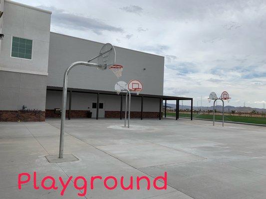 Basketball courts adjacent to elementary playground