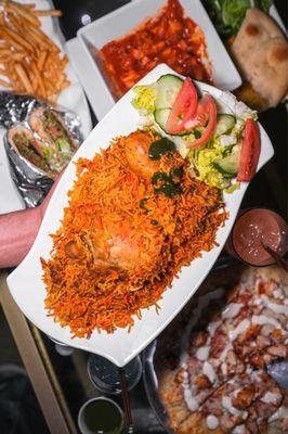 Chicken biryani - butter chicken on the top of the photo