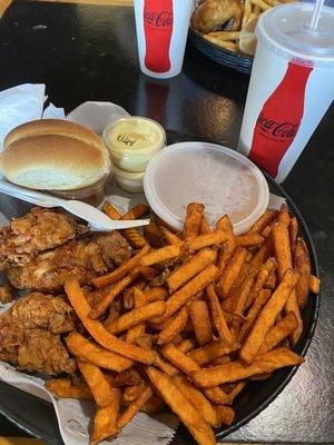 1/2 lb (3) chicken tenders with sweet potato fries and baked beans.