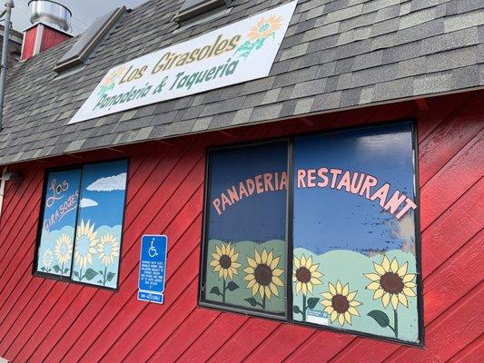 Exterior of restaurant in a big red barn.