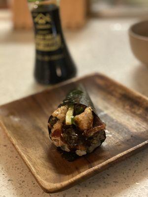 Fried salmon skin hand roll with cucumber and special sauce. This hand roll is light, fresh and salty fried:)