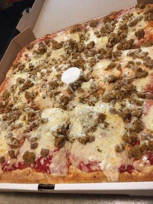 Sicilian style pizza with sausage and cheese