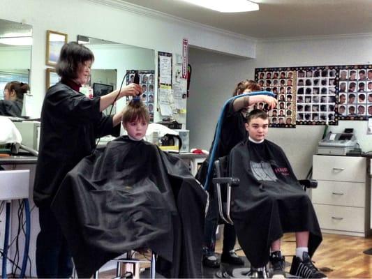 My boys getting their hair cut at Barber Express