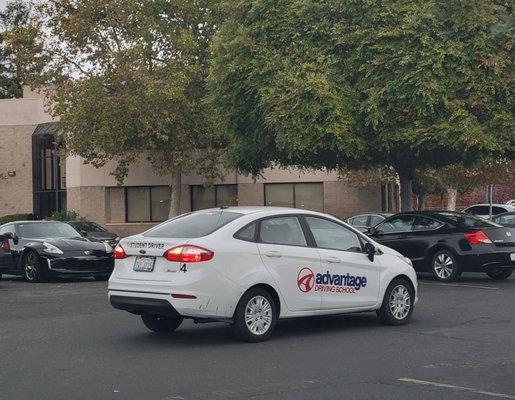 Student driver doing laps in parking lot