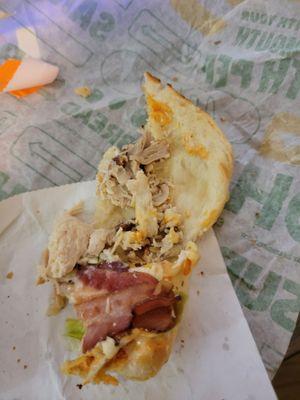 There you can see the chicken is barely there with 2-3 inches of sandwich left to eat.