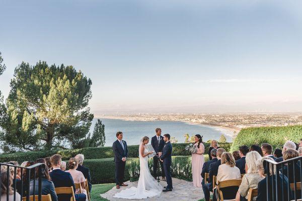 coastal ceremony photo of bride and groom exchanging their vows