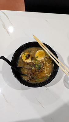 Beef Ramen with hot chili paste on the side.