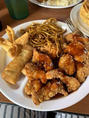 Fire cracker chicken, noodles, crab Rangoon, and egg roll.