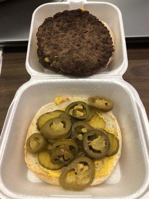 Double-meat Cheeseburger with mustard, pickles, and jalapeños