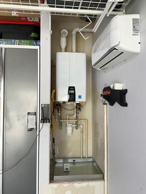 NAVIEN Tankless Water Heater installed in garage