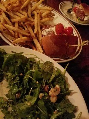 Lamb burger (they split in half for us), and a half eaten pear and walnut salad.