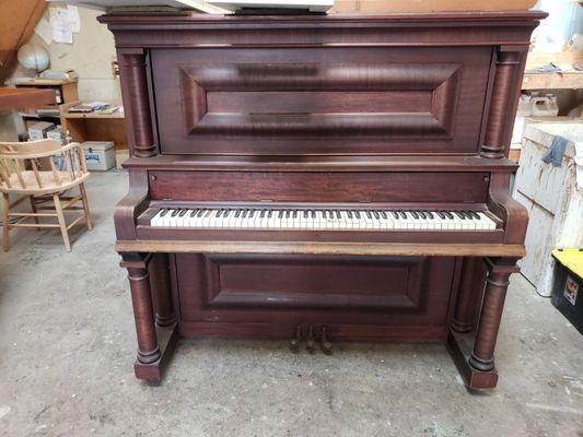 Upright piano before a strip and refinish.