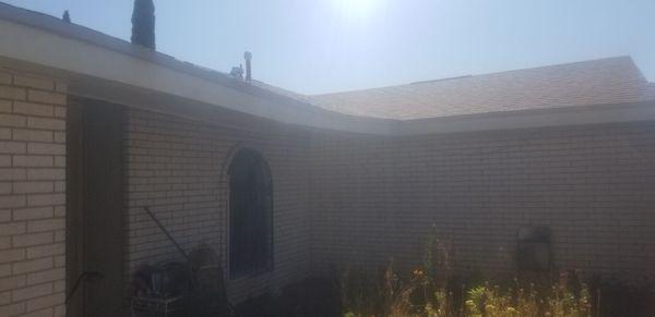 Roof with new shingles, but unrepaired structural damage.