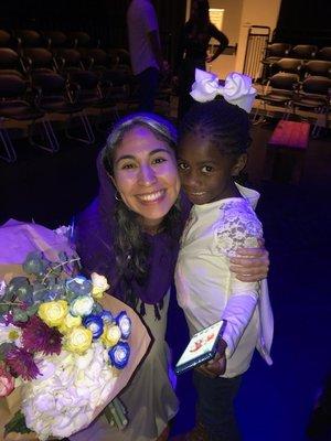 A young audience member greets the performer in Mary's Song, an original work of Exalted Arts Theatre Company.