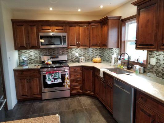 New kitchen sheetrock, electric, plumbing and cabinetry installed tile floors and backsplash