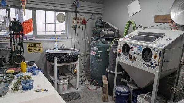 "coldworking" equipment - lap wheel, sand blaster (belt sander on the left)