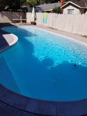 Residential swimming pool in Modesto after pool service.