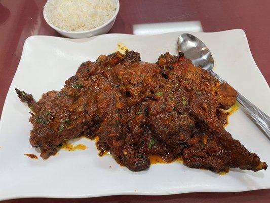 Goat chops with masala. Very delicious! Also very spicy. Delicious. Served with rice.