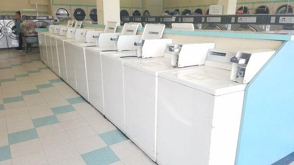 White machines (random #s): $1.50/load (6 quarters). Current as of Sept 2018