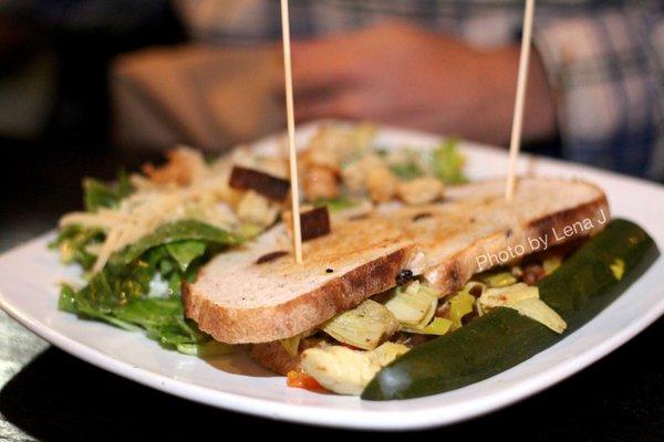 Warm Artichoke Sandwich ($15) - marinated artichokes, pepperoncini, roasted red peppers, chickpea spread, feta, olive bread