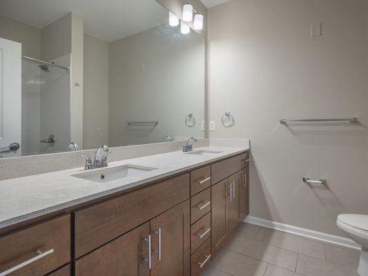 Bathroom with plenty of counter space and double sinks.