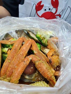 Combo #7 shrimp snow crab and mussels with corn potatoes and broccoli.