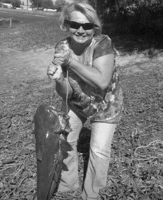 Lady caught a huge catfish in the pond