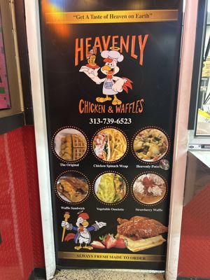 The door display with menu items and contact info.