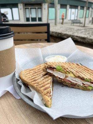 Turkey and bacon sandwich on rye, as well as a pistachio latte